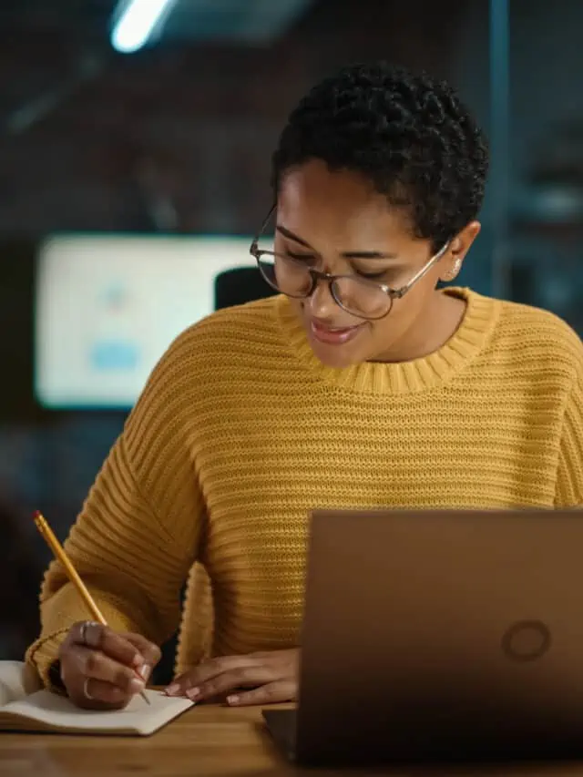 Young,Hispanic,Marketing,Specialist,Working,On,Laptop,Computer,In,Busy