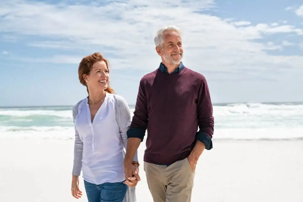 retired couple on the beach
