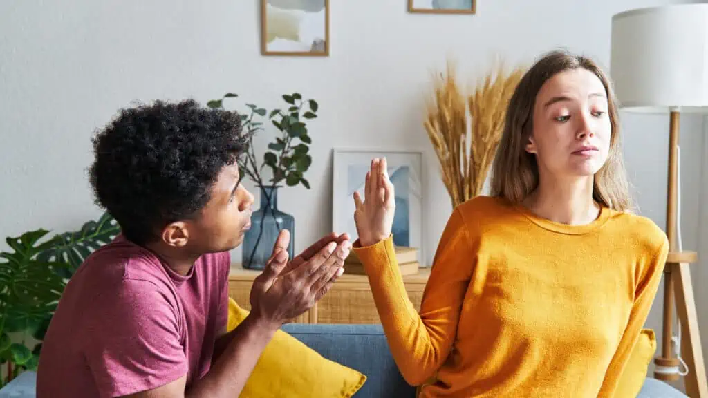 man apologizing to woman sorry