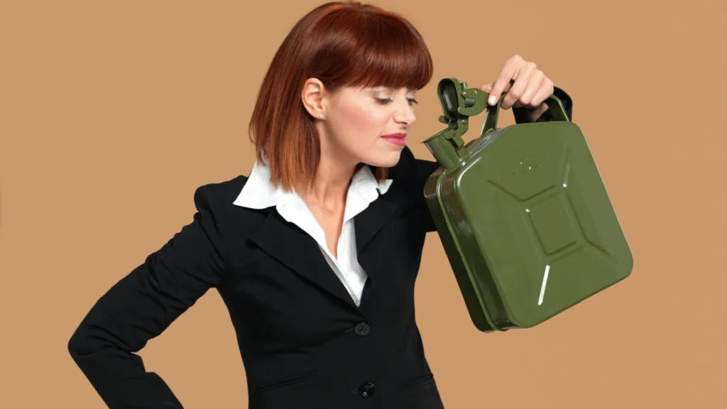 A woman smelling gas canister