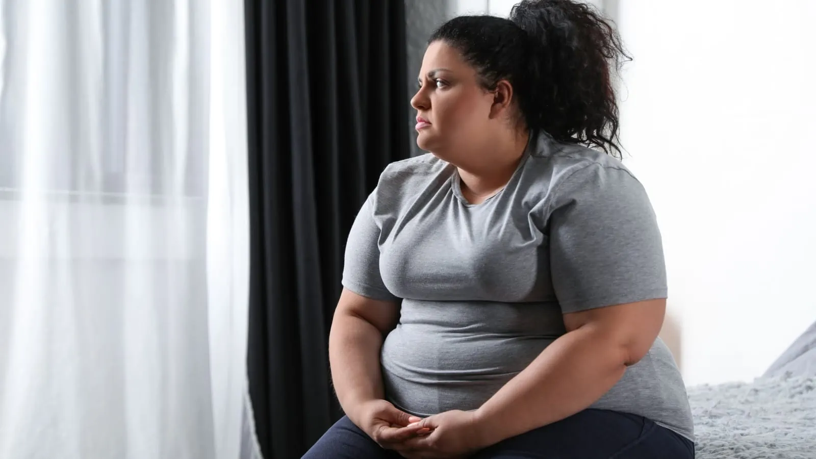 sad overweight woman