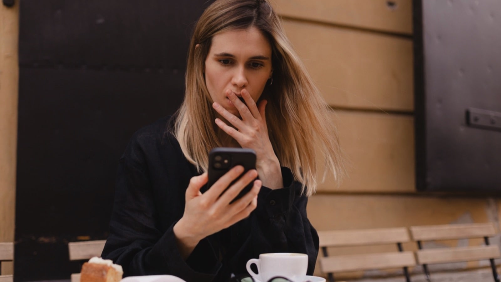 Woman shocked seeing mobile
