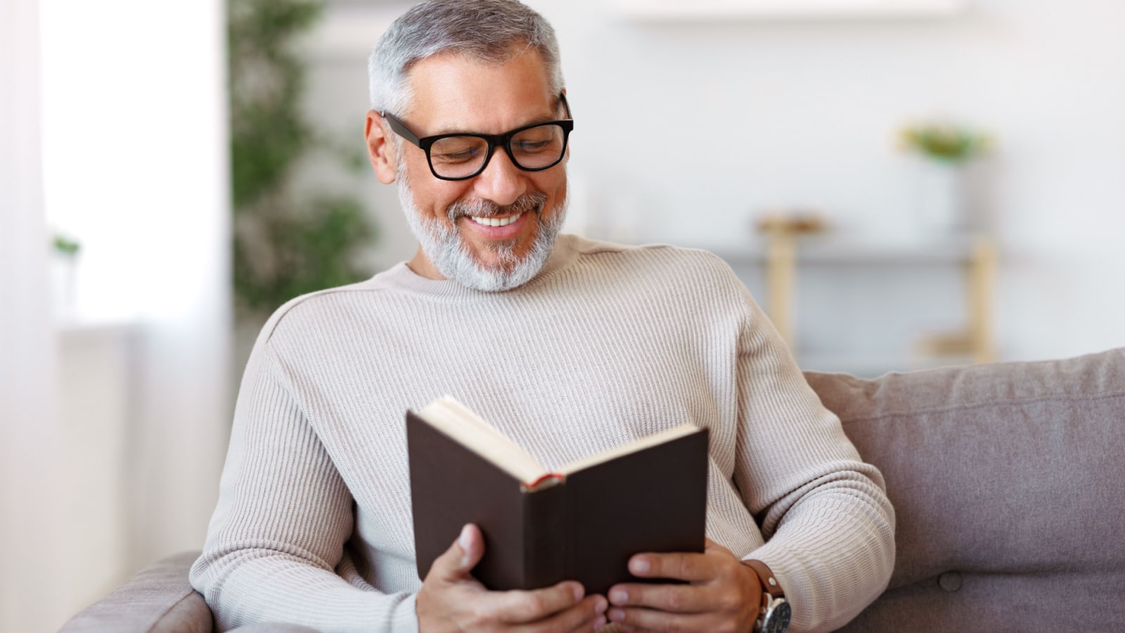 Middle aged man reading a book